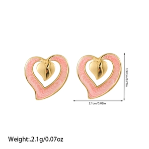 Detail view of heart-shaped pink enamel earrings with gold plating and size measurements