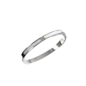 Brazalete de plata pulida con incrustación de nácar blanco y tres diamantes brillantes