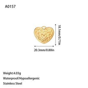 Golden heart-shaped stainless steel pendant with intricate filigree engraved pattern