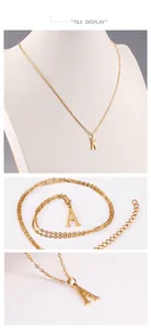 Close-up of 18K gold stainless steel letter pendant with lobster clasp and adjustable chain