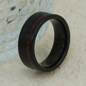 Men's black tungsten ring with red wood inlay and polished beveled inner edges