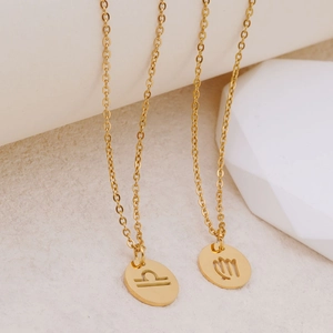 Elegant 18K gold hollow zodiac pendant necklace featuring Libra and Virgo signs
