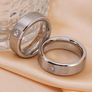 Mens minimalist brushed titanium steel ring set with square diamond inlay on silk fabric
