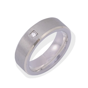 Detail of silver titanium ring with brushed metal texture and a small square set zircon