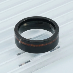 Polished black tungsten ring with red wood inlay, stylish minimalist jewelry for men