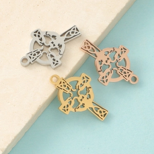 Detail of three geometric stainless steel bar pendants in silver, gold and rose gold finishes