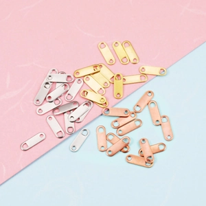 Polished heart-shaped oval jewelry tags in gold, silver, and rose gold with dual holes