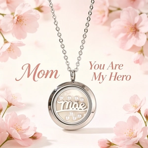 Detail view of stainless steel locket necklace with Mae and pearl accents.