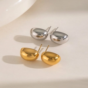 Polished titanium steel bean earrings in gold and silver finish with organic drop shape