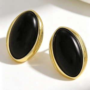 Vintage minimalist oval black resin stud earrings with a gold geometric metal frame