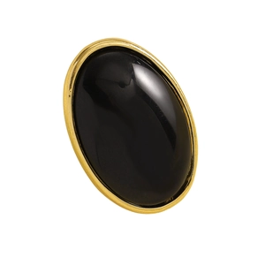 Detailed view of a vintage oval stud earring with black resin and gold frame