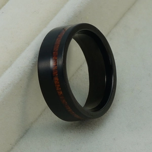Men's black tungsten steel ring with wood inlay and matte finish from side view