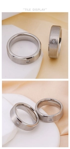 Detail view of brushed titanium steel ring with small square-cut cubic zirconia stone