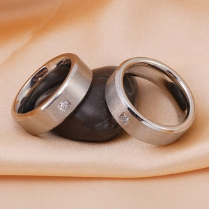 Minimalist silver titanium steel rings with brushed finish and single diamond accent