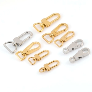 Various polished stainless steel lobster clasps and gold keychains with D-rings