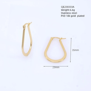 Detailed view of polished gold teardrop earrings with dimensions 35mm by 23mm