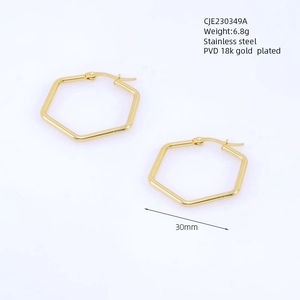Detail of 30mm hexagonal gold earrings in PVD 18k gold plated stainless steel