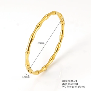 Macro shot of 18K gold plated stainless steel bamboo bracelet with size and weight specs