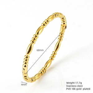 Detail showing 18K gold plated stainless steel bamboo bracelet with 68mm inner diameter