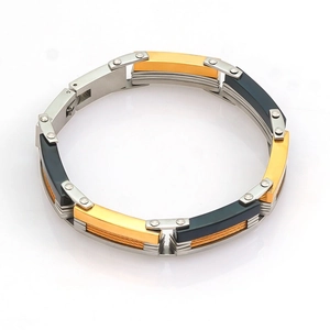 Mechanical style stainless steel bracelet with gold and silver rivets for men