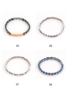Detail view of various stainless steel link bracelets with blue, black and silver finishes