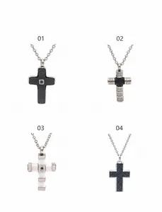 Detail display of four cross pendants featuring diamond inlay and industrial textures