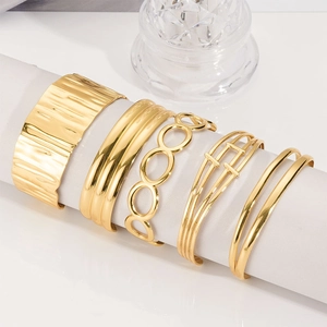 5-piece gold-plated stainless steel bangle set with hammered and geometric textures