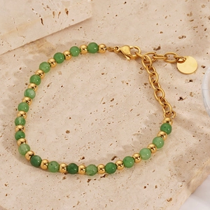 Detail of 18K gold-plated stainless steel bracelet with green stone beads and lobster clasp