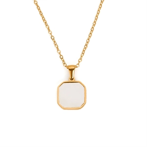 Detail of a gold octagonal necklace with white enamel inlay on a minimal chain
