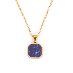Macro shot of gold stainless steel necklace with square blue marble octagon pendant