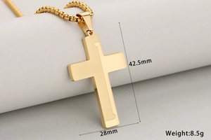 Macro shot of two-tone gold cross pendant with dimensions 42.5mm by 28mm and 8.5g weight