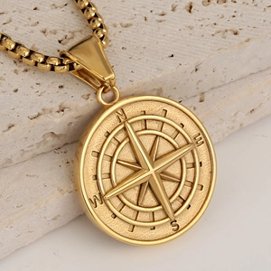 Collar con colgante de brújula de acero inoxidable dorado con estrella 3D sobre piedra