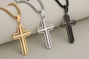 Three hollow cross necklaces in gold, silver and black finishes with box chains