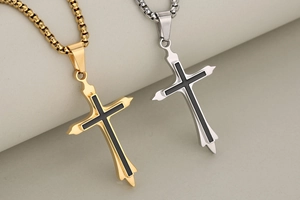 Detailed macro view of double-layer stainless steel cross pendant in gold and silver finish