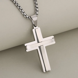Polished stainless steel 3D cross pendant necklace with box chain on elegant stand