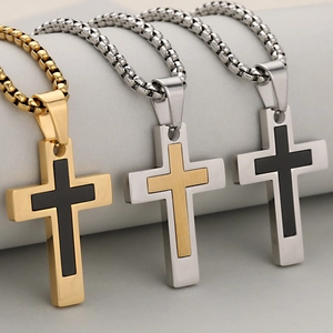 Three-color hip-hop stainless steel cross necklaces with brushed finish on gray pedestals