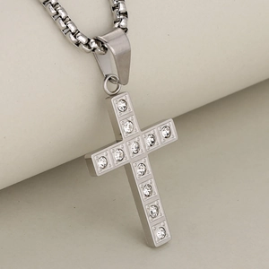 Sleek silver stainless steel cross pendant with sparkling crystals on a box chain