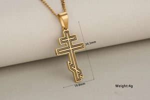 Macro view of gold Orthodox cross pendant showing dimensions 34.3mm by 19.8mm