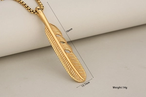 Detail view of a long gold feather pendant with 70mm length and 13.7mm width specifications
