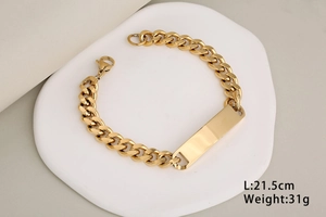 Close-up of golden curved bar on Cuban link bracelet with lobster clasp and weight specs