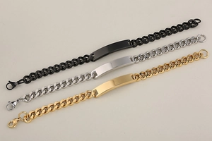 Detailed view of minimalist stainless steel ID bracelets in black, silver, and gold finishes