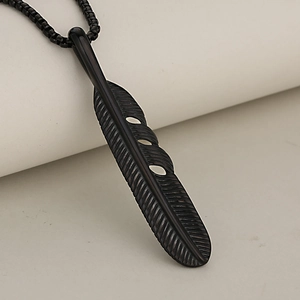 Matte black stainless steel feather pendant necklace with detailed texture on bead chain