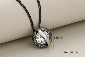 Macro shot of 18mm round crystal pendant with THANK YOU FOR YOUR LOVE engraving