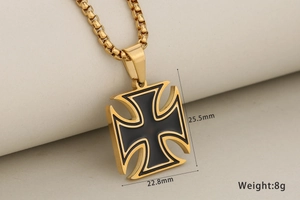 Macro detail of golden Iron Cross pendant with black enamel inlay and size dimensions