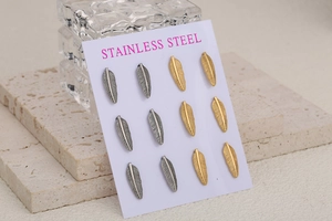 Detail of 6 pairs feather shaped stainless steel stud earrings in gold and silver