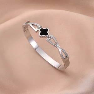 Silver stainless steel hinge bracelet with black clover motif and clear zircon stones