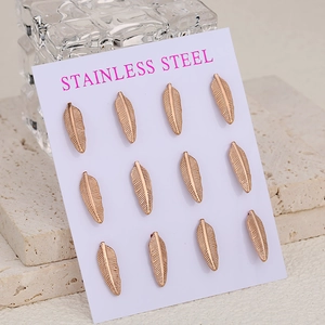 Rose gold stainless steel feather stud earrings set of six pairs on display card