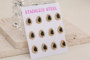 Close-up of 6 pairs of gold-plated stainless steel teardrop earrings on display card