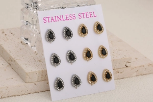 Detail of 6 pairs of stainless steel teardrop earrings with black stones and pavé crystals