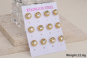 Set of 9 minimalist gold stainless steel round stud earrings with crystals on display